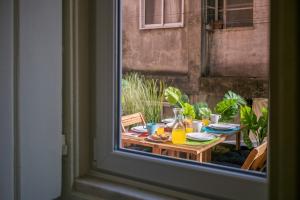 a view of a table with food on it from a window at Hip Tailor Made Flat in Bairro Alto in Lisbon