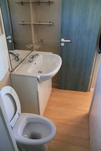 a bathroom with a toilet and a sink at Camping Fontana delle Rose in Mattinata +96 photos