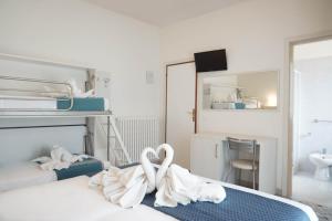 Postel nebo postele na pokoji v ubytování Hotel Caribe
