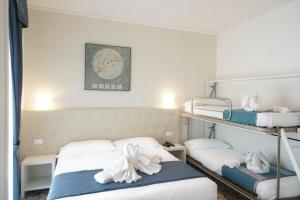 Postel nebo postele na pokoji v ubytování Hotel Caribe