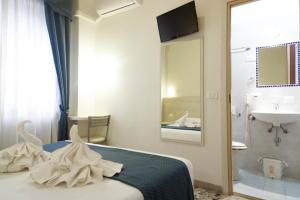Postel nebo postele na pokoji v ubytování Hotel Caribe