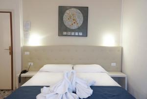 Postel nebo postele na pokoji v ubytování Hotel Caribe