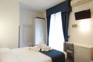 Postel nebo postele na pokoji v ubytování Hotel Caribe