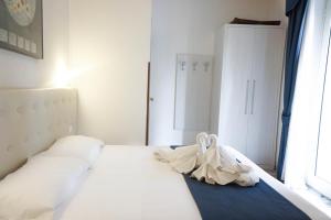 Postel nebo postele na pokoji v ubytování Hotel Caribe