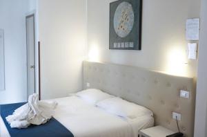 Postel nebo postele na pokoji v ubytování Hotel Caribe