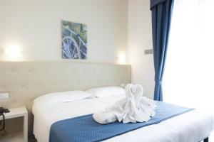 Postel nebo postele na pokoji v ubytování Hotel Caribe