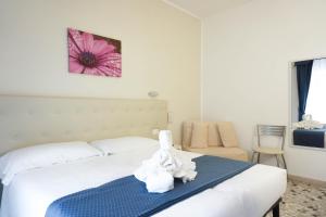 Postel nebo postele na pokoji v ubytování Hotel Caribe
