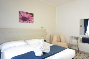 Postel nebo postele na pokoji v ubytování Hotel Caribe