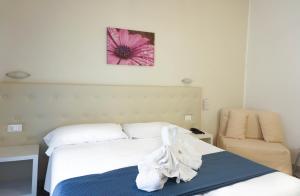 Postel nebo postele na pokoji v ubytování Hotel Caribe
