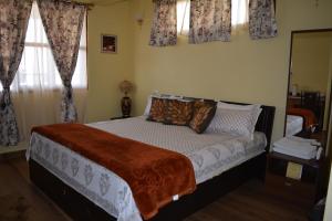 Letto o letti in una camera di Dew Drop In