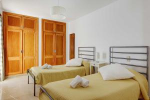Posteľ alebo postele v izbe v ubytovaní Villa Fort View
