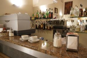 Příslušenství pro přípravu čaje a kávy v ubytování Hotel Caribe