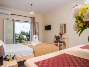 A bed or beds in a room at Dallas Hotel