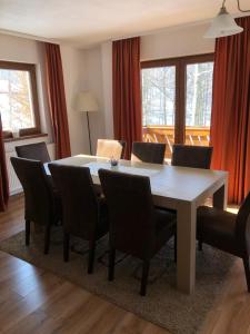 a dining room with a table and chairs at Casa de vacanta Mogosa in Baia-Sprie