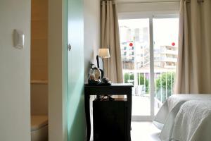 Postel nebo postele na pokoji v ubytování Hostal Jakiton
