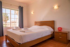 Ένα ή περισσότερα κρεβάτια σε δωμάτιο στο Praia do Vau Apartment +20 φωτογραφίες