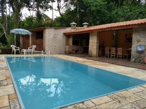Bazén v ubytovaní Solar das Canoas Prumirim alebo v jeho blízkosti