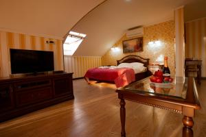 Ein Bett oder Betten in einem Zimmer der Unterkunft Golden House Hotel