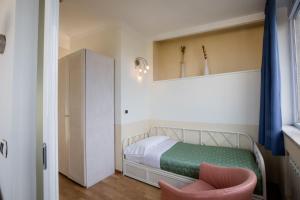 Postel nebo postele na pokoji v ubytování Hotel Duomo