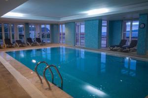 a large swimming pool in a hotel room at Azoris Faial Garden – Resort Hotel in Horta