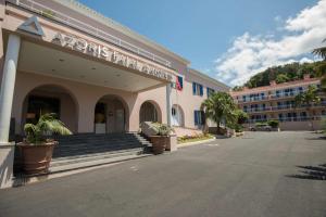 a building with a sign on the front of it at Azoris Faial Garden – Resort Hotel in Horta