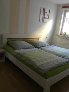 Giường trong phòng chung tại Ferienwohnung Misch