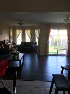 a living room with a couch and a table at Sweet Dreams in Guelph