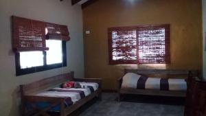 Postel nebo postele na pokoji v ubytování Cabañas Kangarú