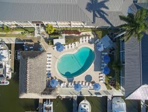 an overhead view of a swimming pool in a resort at Cove Inn on Naples Bay in Naples