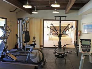 a gym with several treadmills and exercise bikes at CASTLE Kama'ole Sands in Wailea