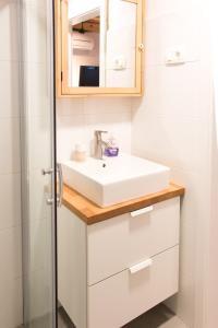 a bathroom with a sink and a shower at Koper2stay in Koper