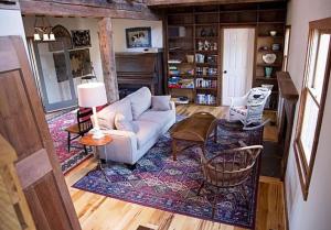 a living room with a couch and a table at River Bluff Farm Bed and Breakfast in Quicksburg