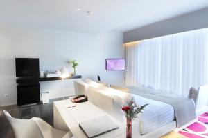 A television and/or entertainment center at Mode Sathorn Hotel - SHA Extra Plus