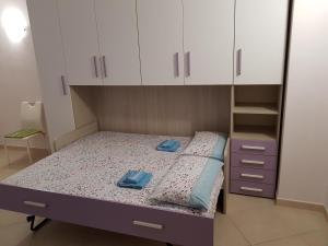 Un pat sau paturi într-o cameră la Cuore di Roma