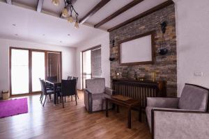 a living room with a couch and a table at Villa 'Iva' in Mavrovo