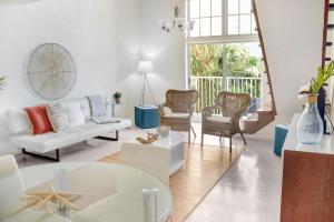 a living room with a couch and a table at Coral Reef at Key Biscayne in Miami