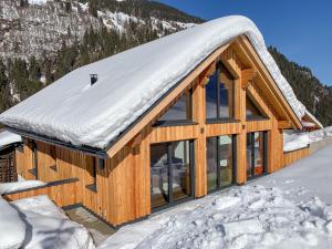 a log cabin with a snow covered roof at Chalet See Tirol - Ischgl/Kappl in See
