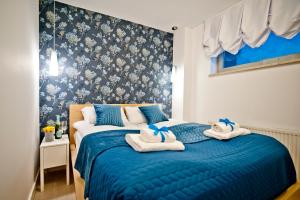 Łóżko lub łóżka w pokoju w obiekcie Willa 4 Żywioły BlueApart Jurata