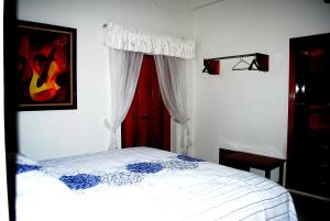 Postel nebo postele na pokoji v ubytování HOTEL POSADA DEL SOL