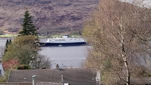 a large boat in a body of water at Melrose in Fort William