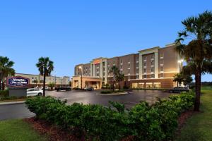 a parking lot in front of a hotel at Hampton Inn & Suites Brunswick in Brunswick