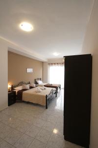 A bed or beds in a room at Arianna Studios 7