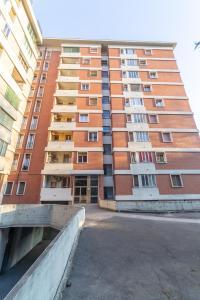 an apartment building in the middle of a street at Bologna Fiera Fani Apartment in Bologna