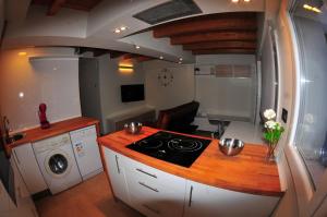 a kitchen with a stove and a sink in it at APARTAMENTOs URDAIBAI 1 in Bermeo