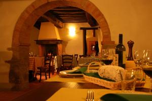 a dining room with a table with wine glasses at Locanda Del Viandante B&B in Anghiari +73 photos