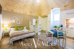 A bed or beds in a room at Dimora Antica Via MiLord