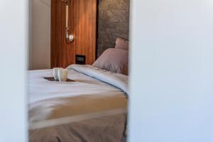 Postel nebo postele na pokoji v ubytování Acropolis Dream Apartment