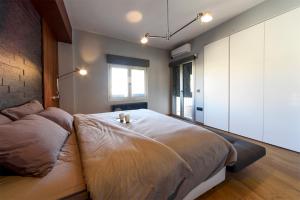 Postel nebo postele na pokoji v ubytování Acropolis Dream Apartment