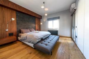 Postel nebo postele na pokoji v ubytování Acropolis Dream Apartment