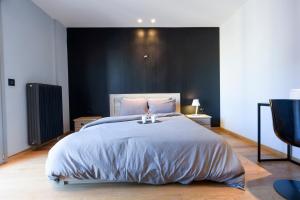 Postel nebo postele na pokoji v ubytování Acropolis Dream Apartment